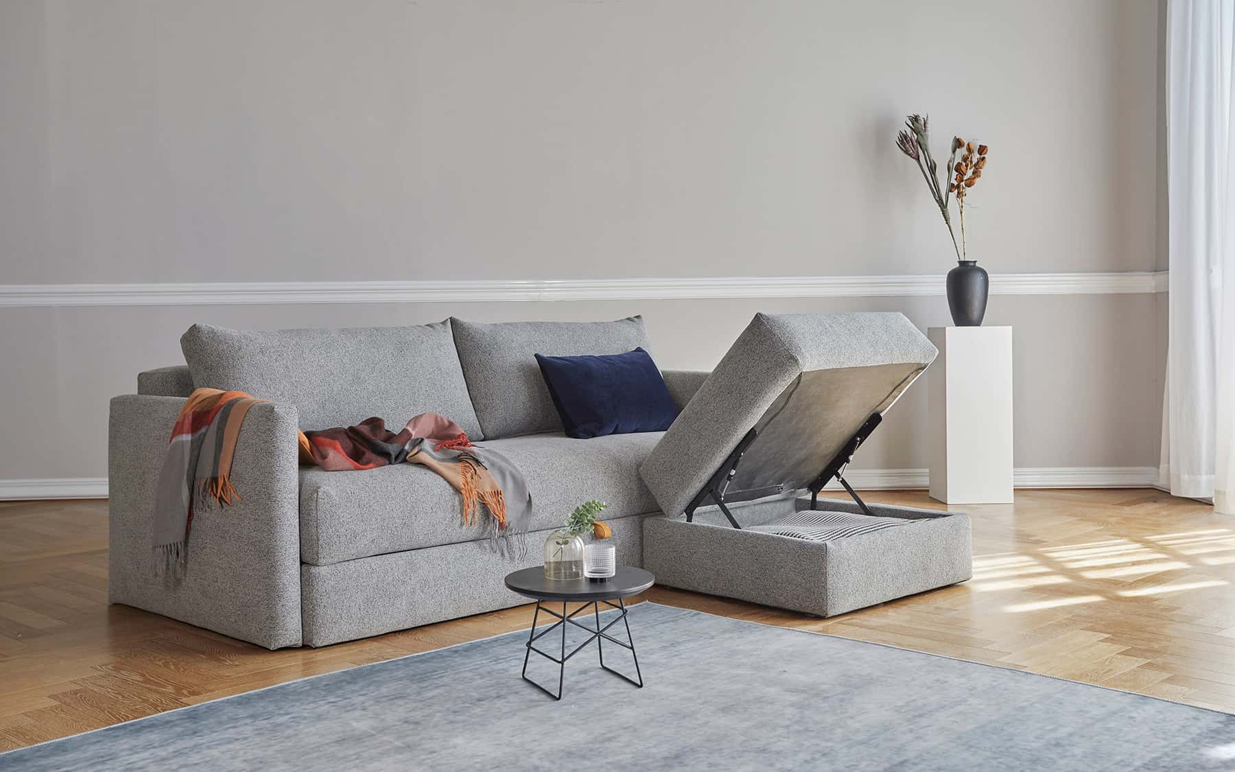 Cornila ottoman with the top lifted to show storage