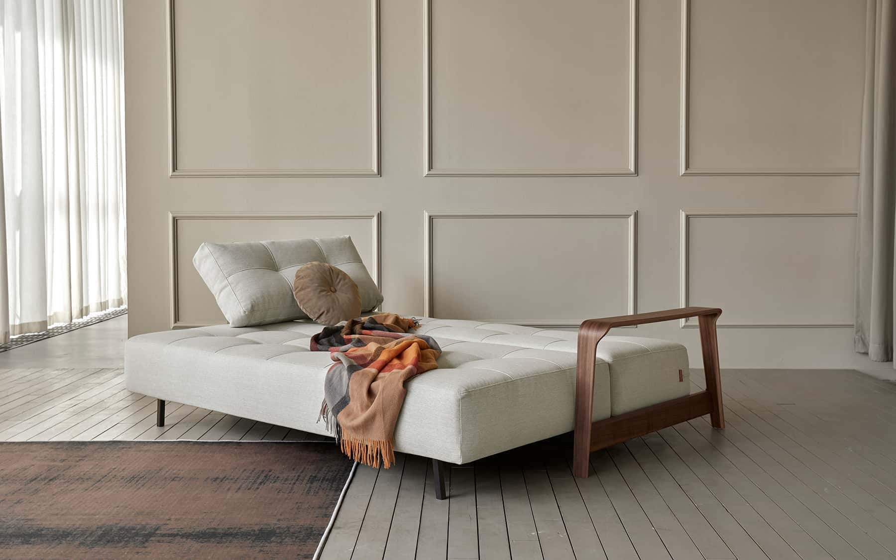 Ran D.E.L. walnut arm and upholstery detail