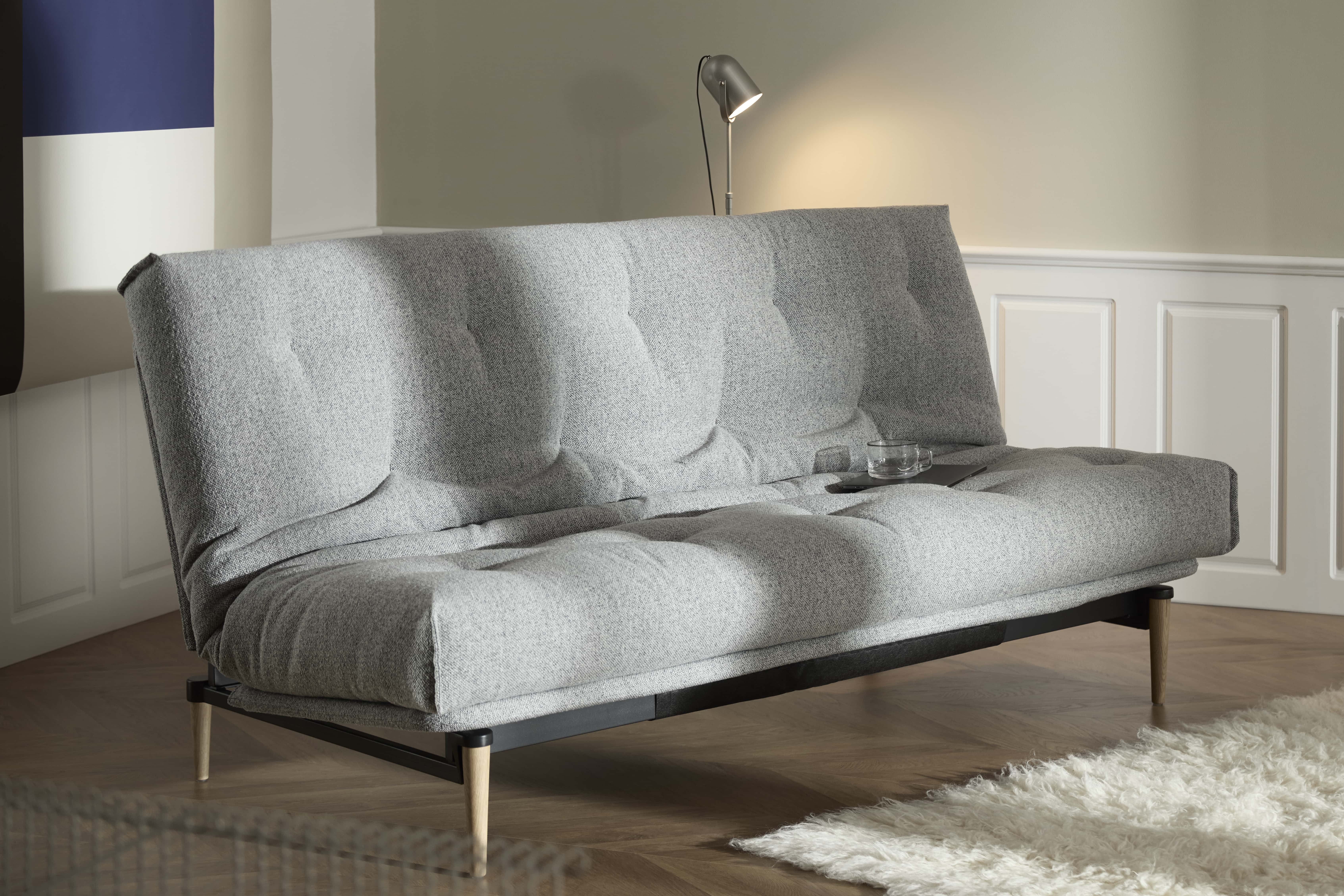 Colpus Futon Sofa Bed with lacquered oak legs, lifestyle photo