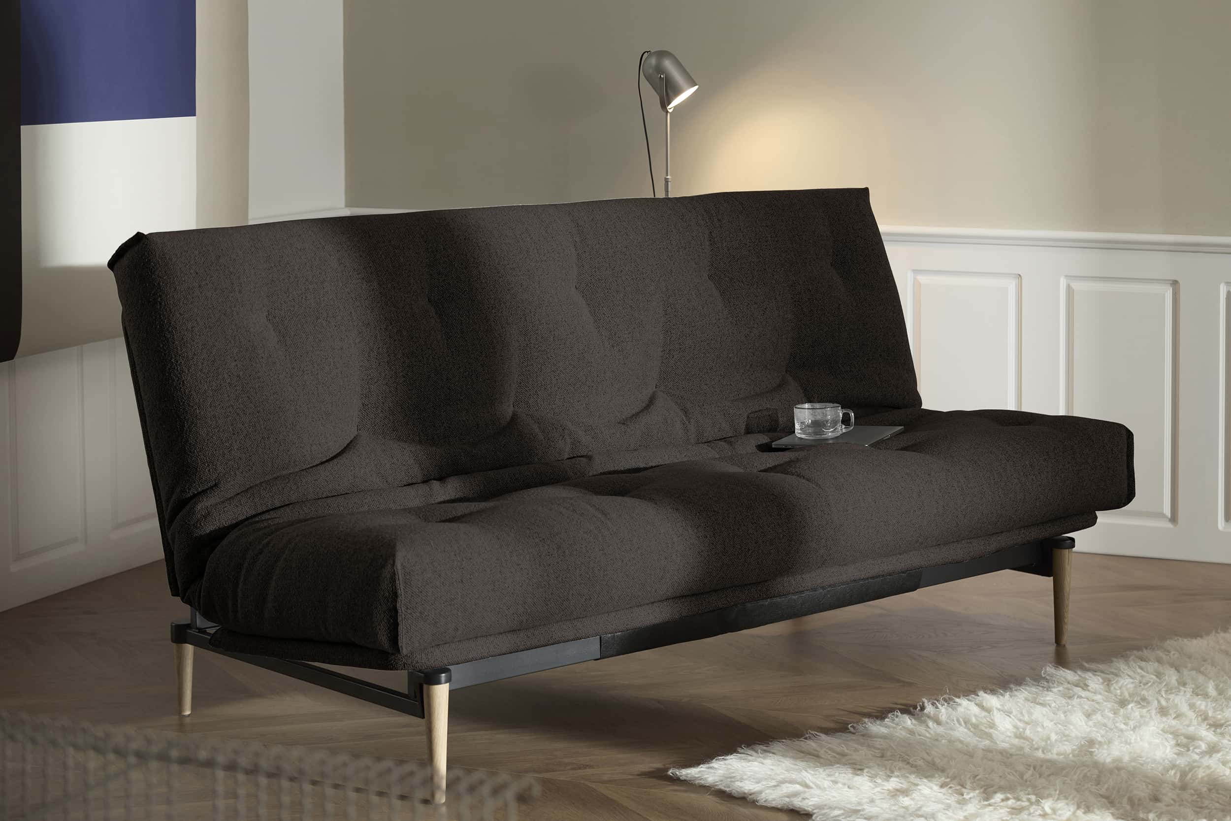 Colpus Futon Sofa Bed with lacquered oak legs, lifestyle photo