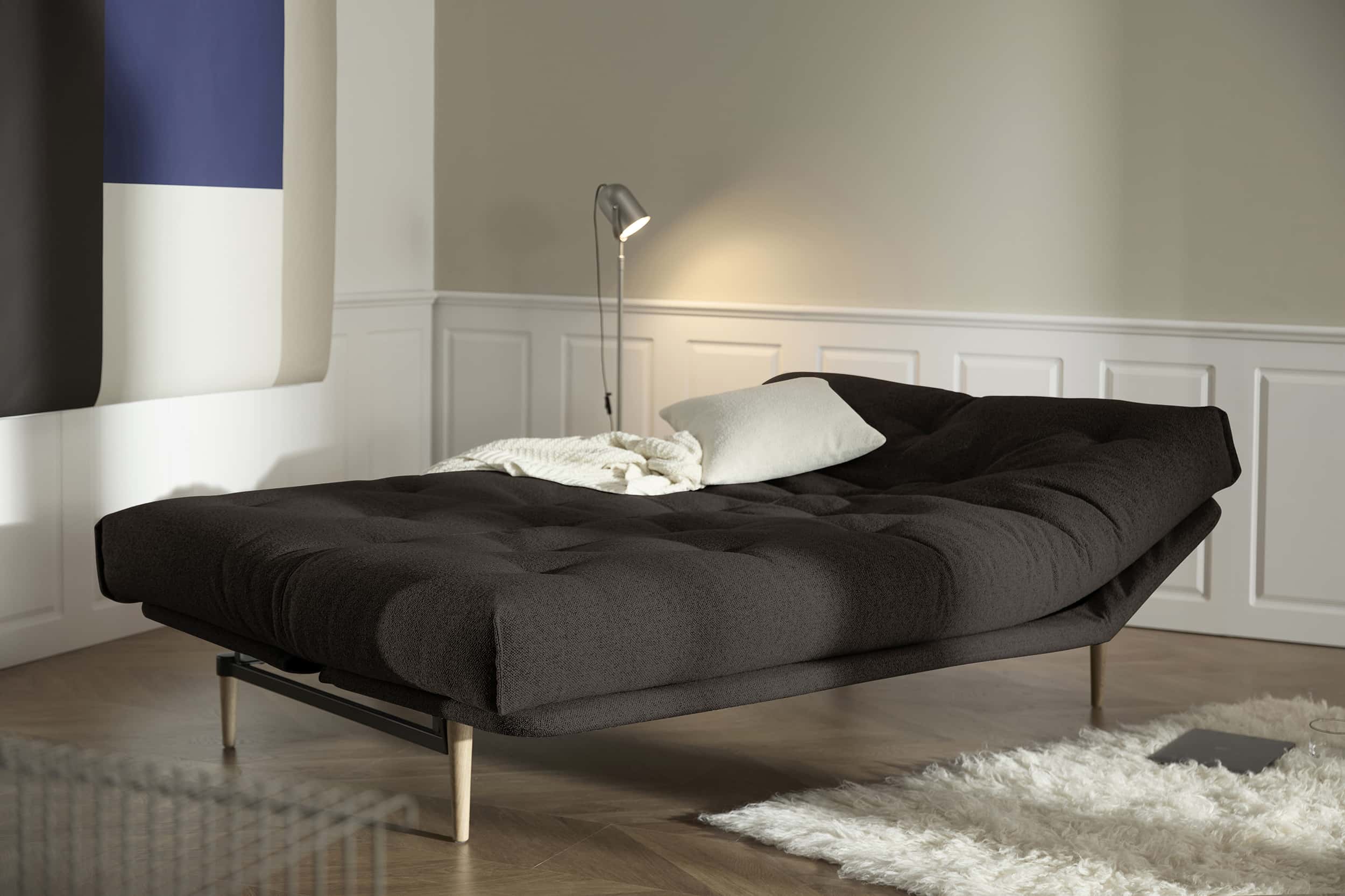 Colpus Futon Sofa Bed with lacquered oak legs, lifestyle photo