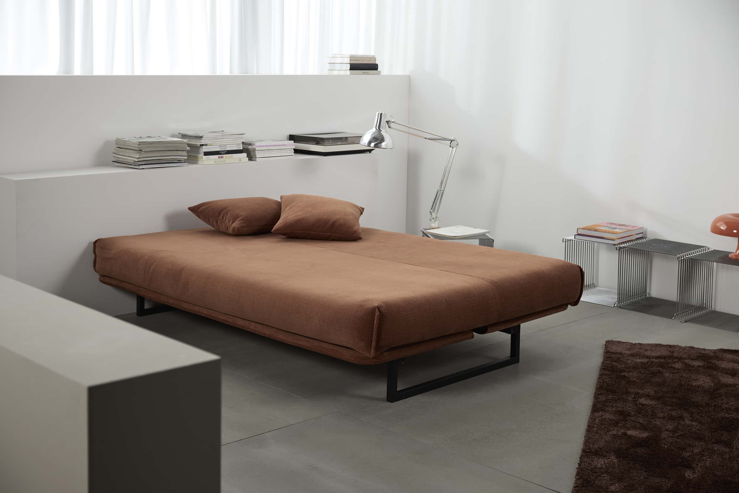 Colpus Futon Sofa Bed with matte black steel legs, lifestyle photo